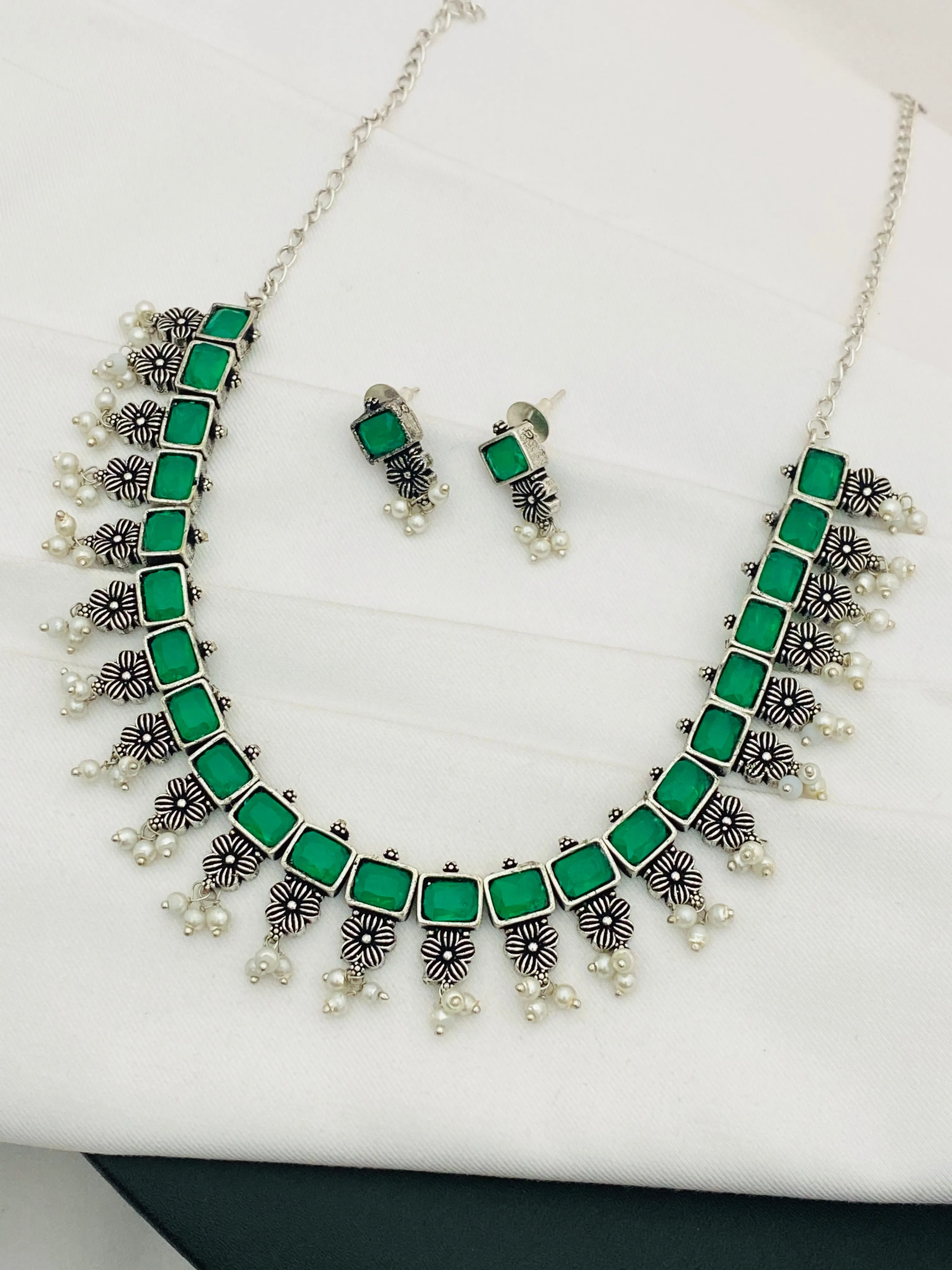 Exclusive Emerald Stone Embellished Designer Oxidized Necklace Set With Earrings And Pearl Beads