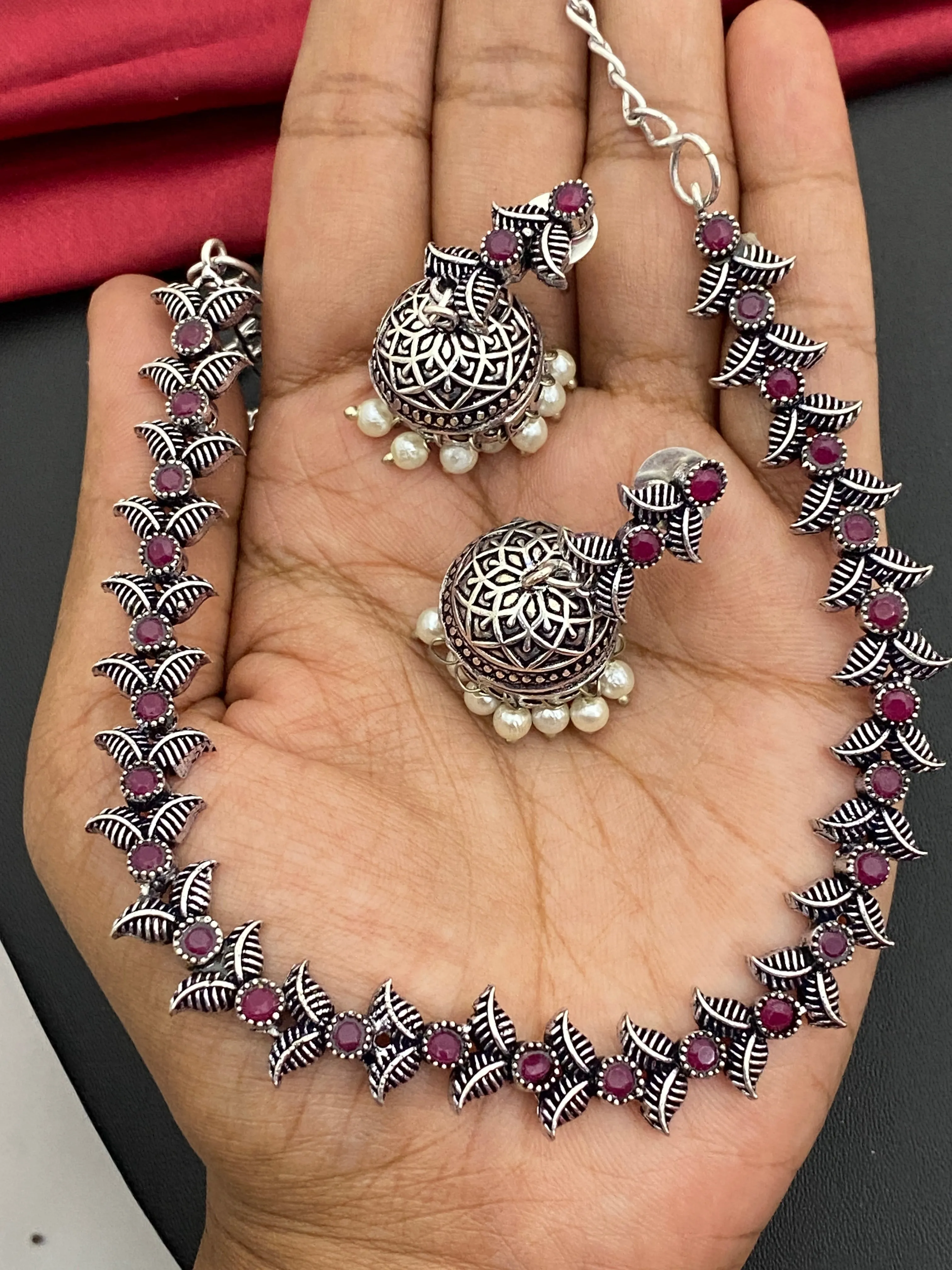 Fascinating Silver Oxidized Ruby Stone Studded Vintage Design Sleek Necklace Set With Jhumka Earrings